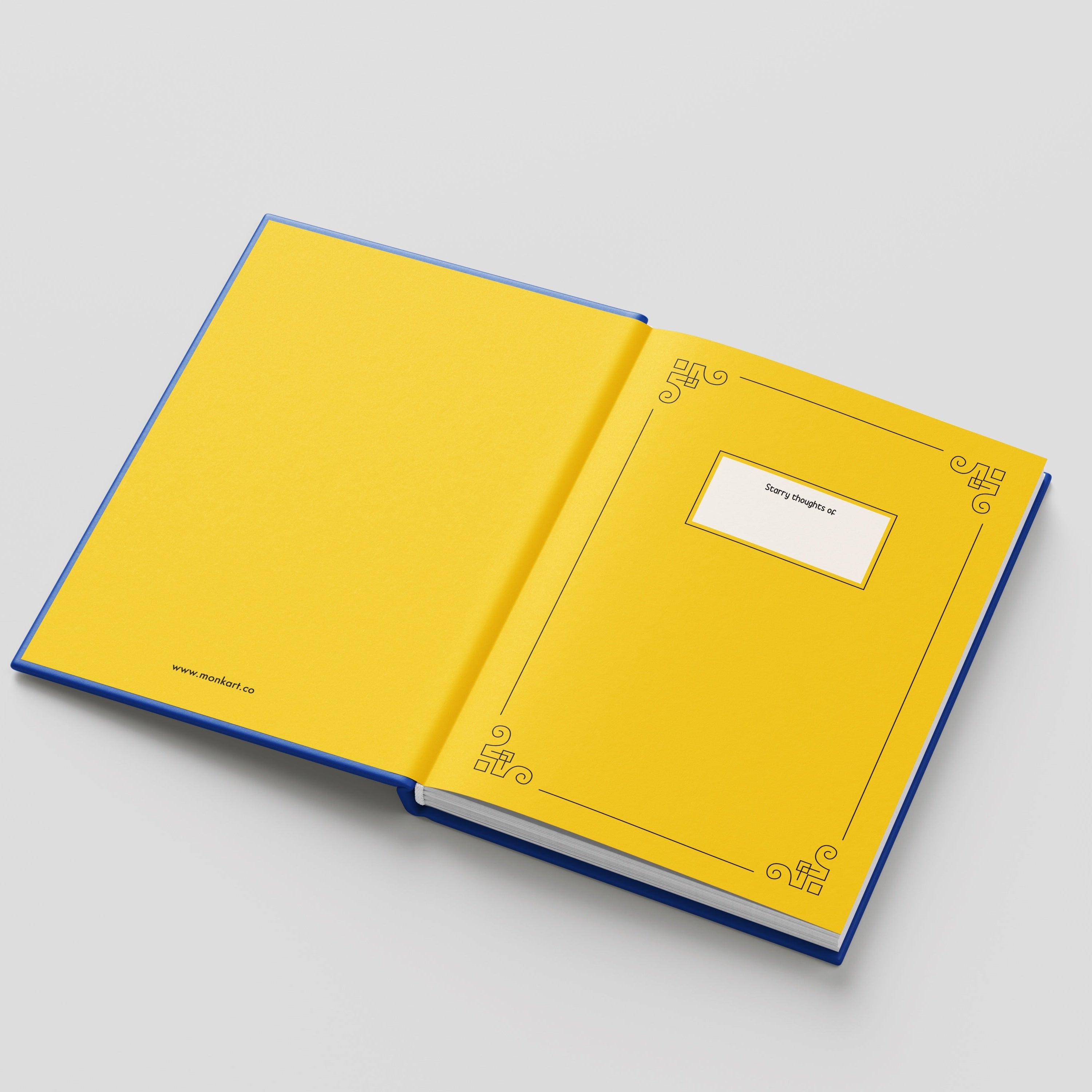 Open yellow notebook with blue edges on a light gray background