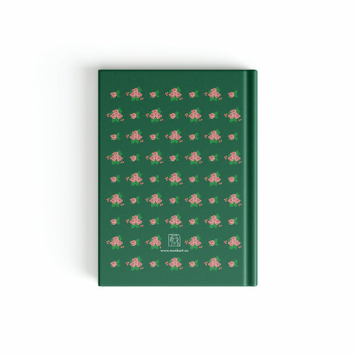 Green notebook with pink floral pattern on a white background