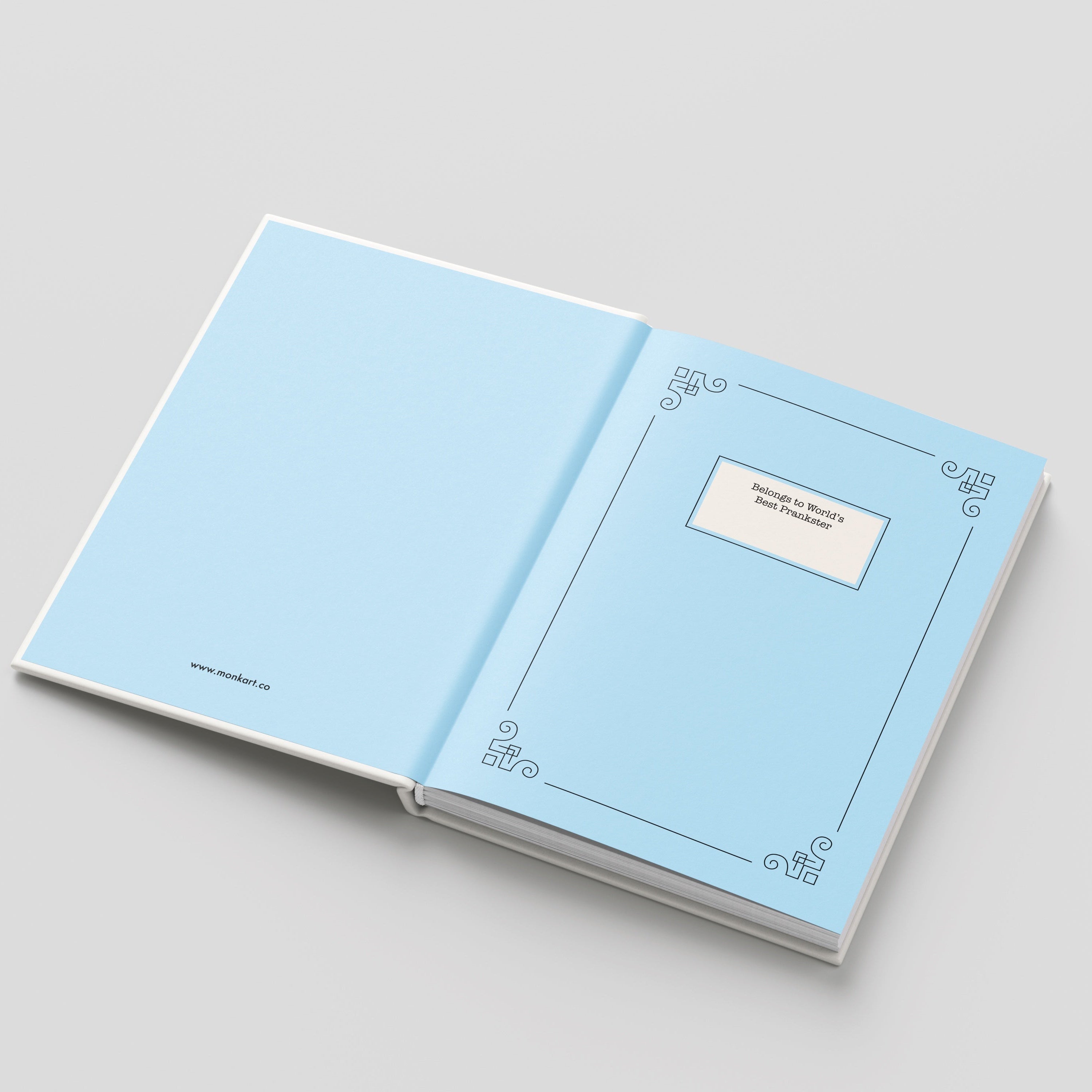 Open notebook with light blue pages on a gray background