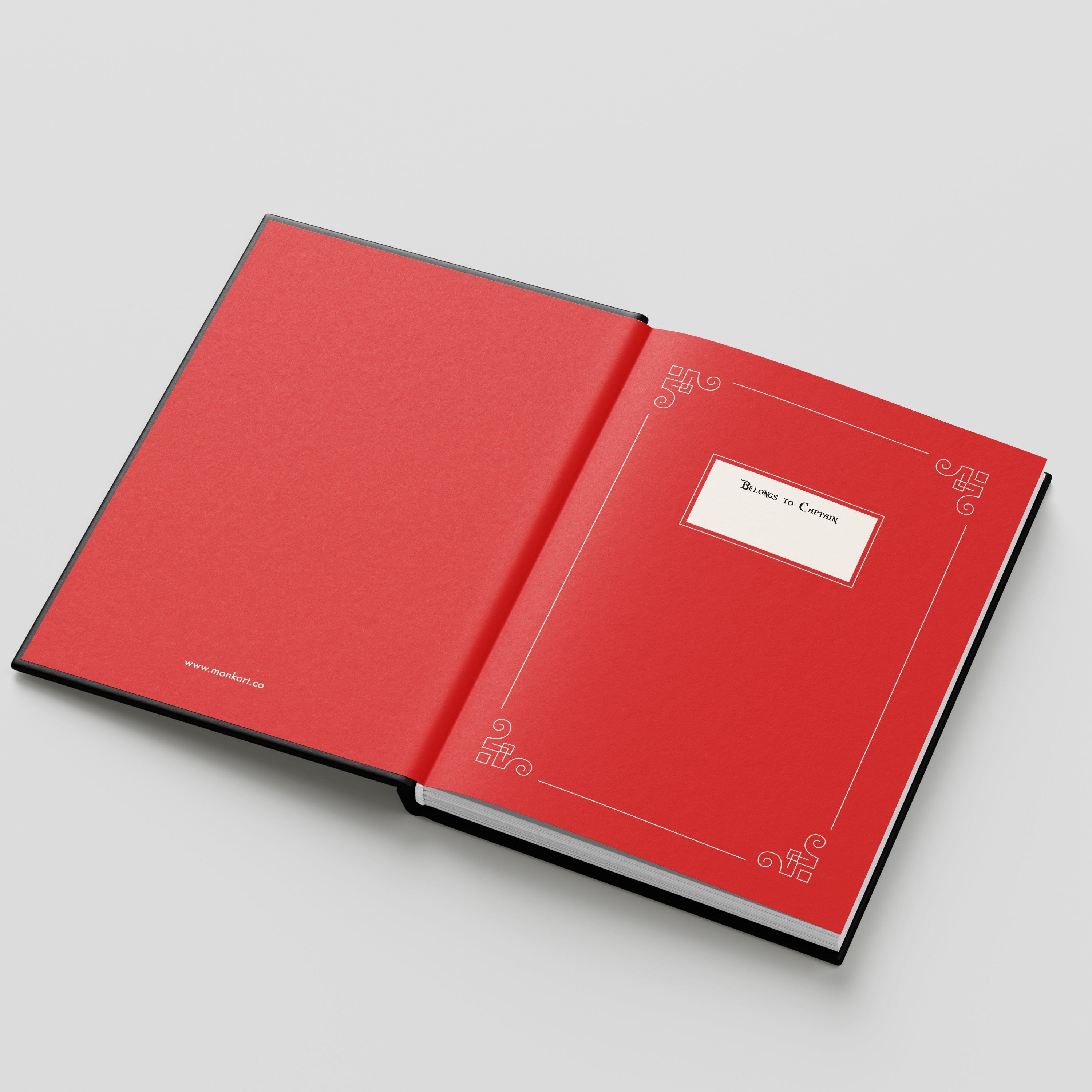 Open red book with decorative elements on a light gray background