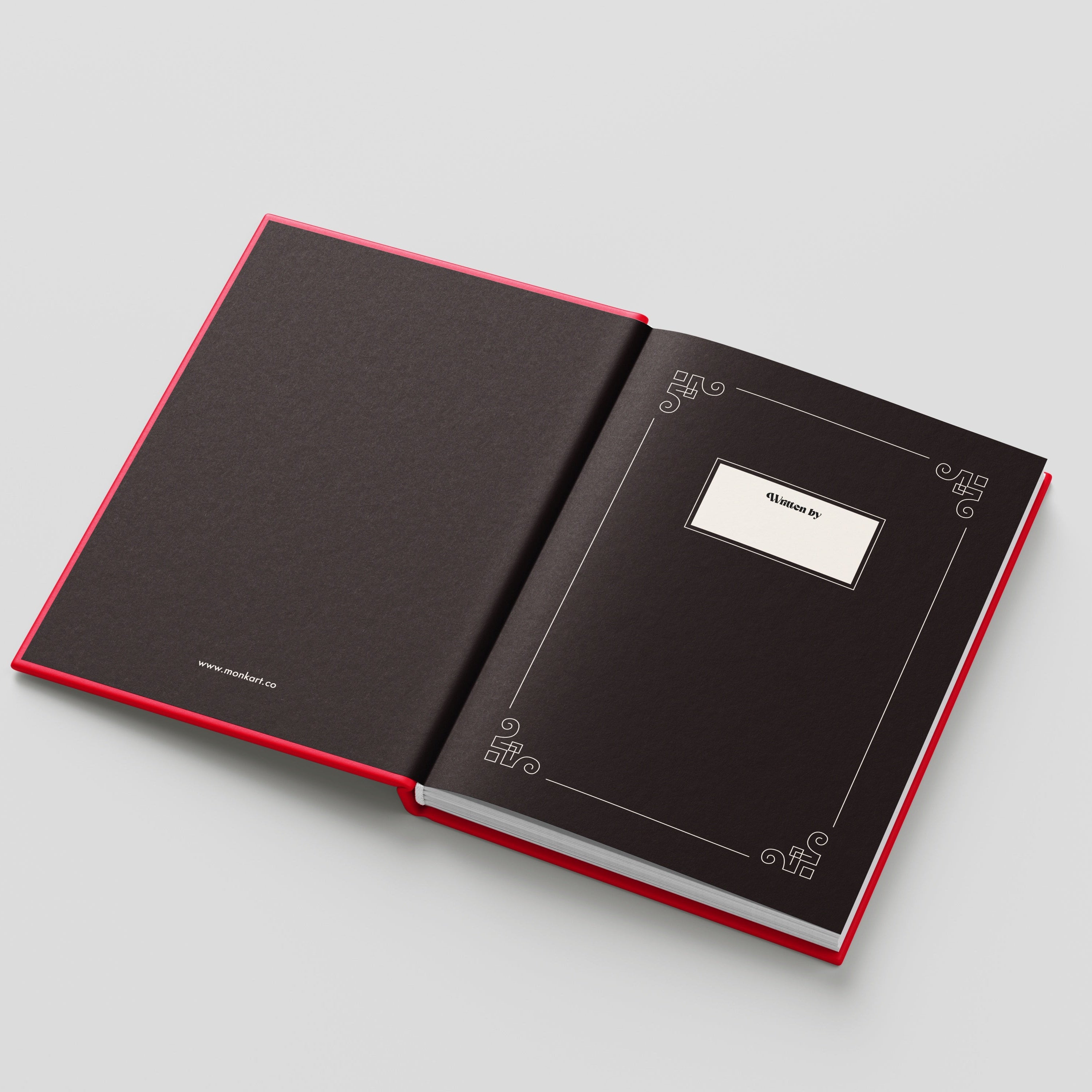 Open black notebook with red edges on a light gray background
